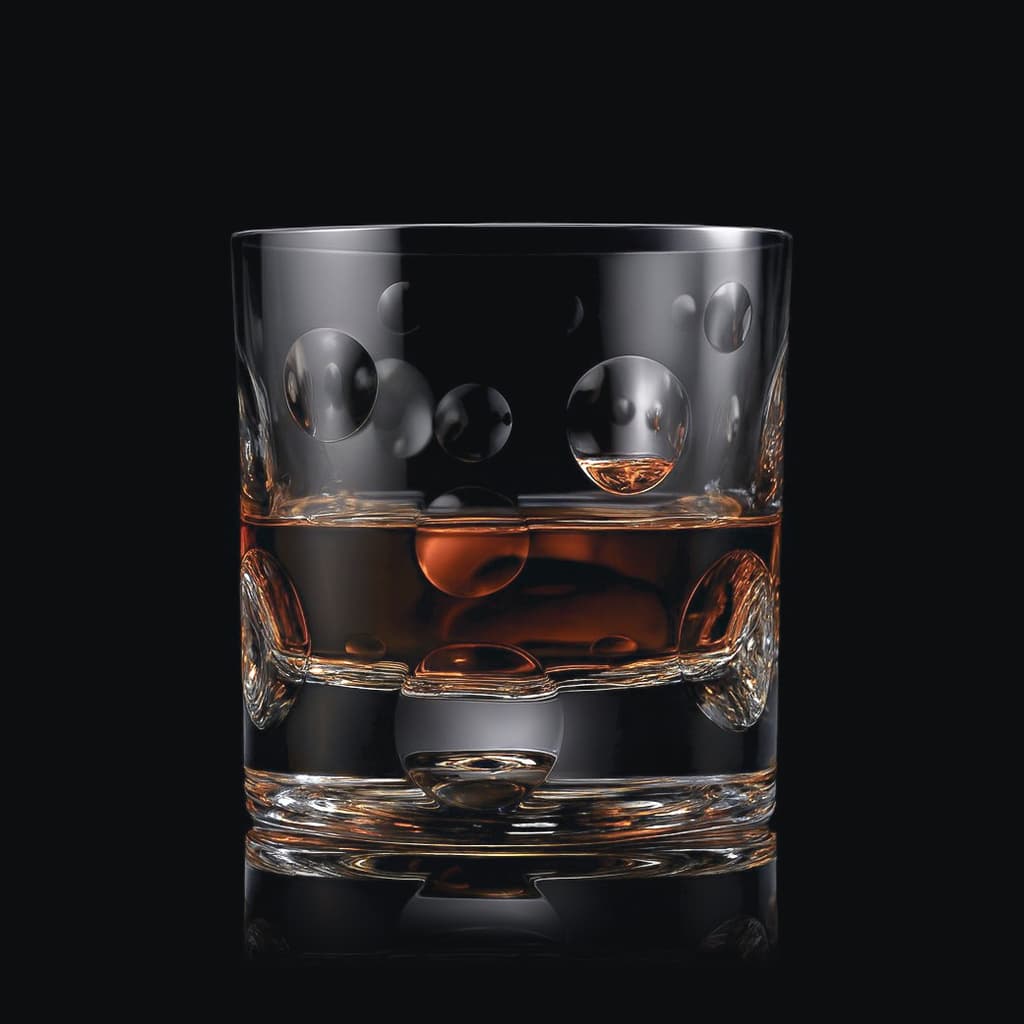 SHTOX Aqua tumbler with whisky, on black