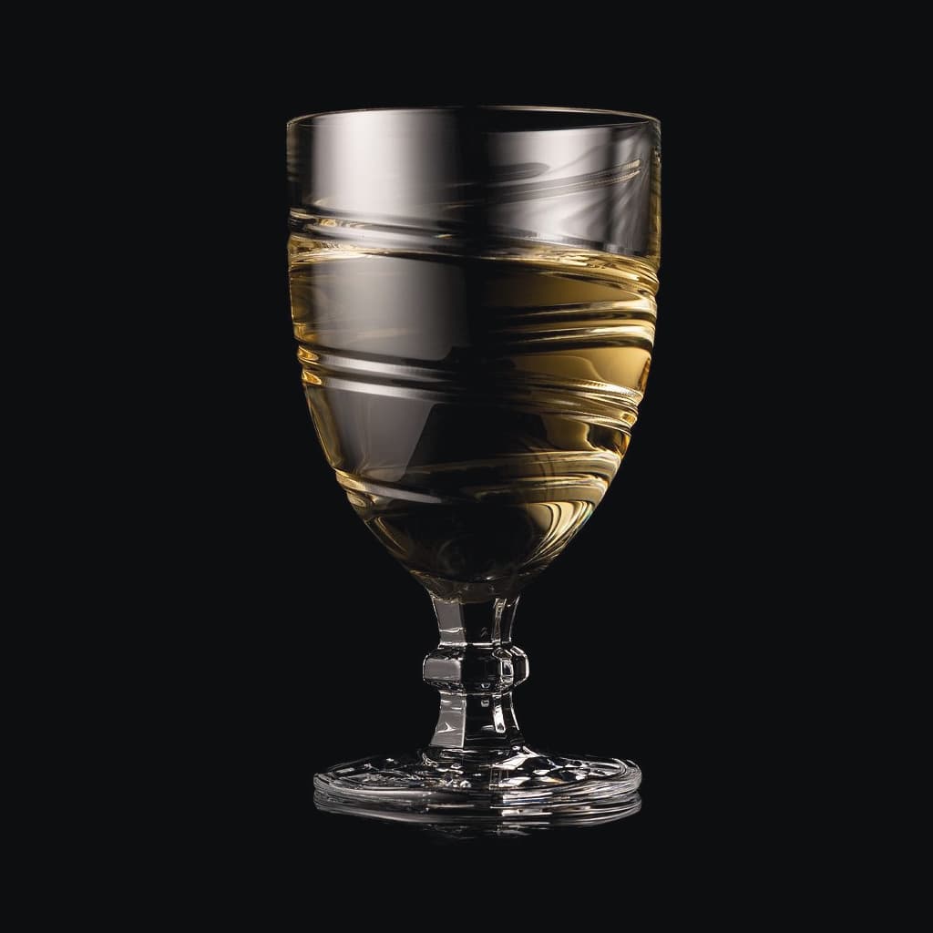SHTOX Vortex wine glass with white wine, on black